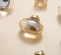 Polished oval crystal and brass cabinet pull/Retro gold glazed egg crystal drawer knob/mid century style smooth polished crystal door handle