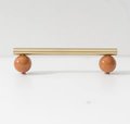 Silky matte gold brass bar handle resting on semi precious stone balls/colourful cabinet handle/stone furniture hardware/crystal drawer pull