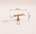 Bronze bar handle resting on white marbl ball/Bronze and marble stone cabinet handle/Semi precious stone and aged brass furniture hardware