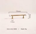 Bronze bar handle resting on white marbl ball/Bronze and marble stone cabinet handle/Semi precious stone and aged brass furniture hardware