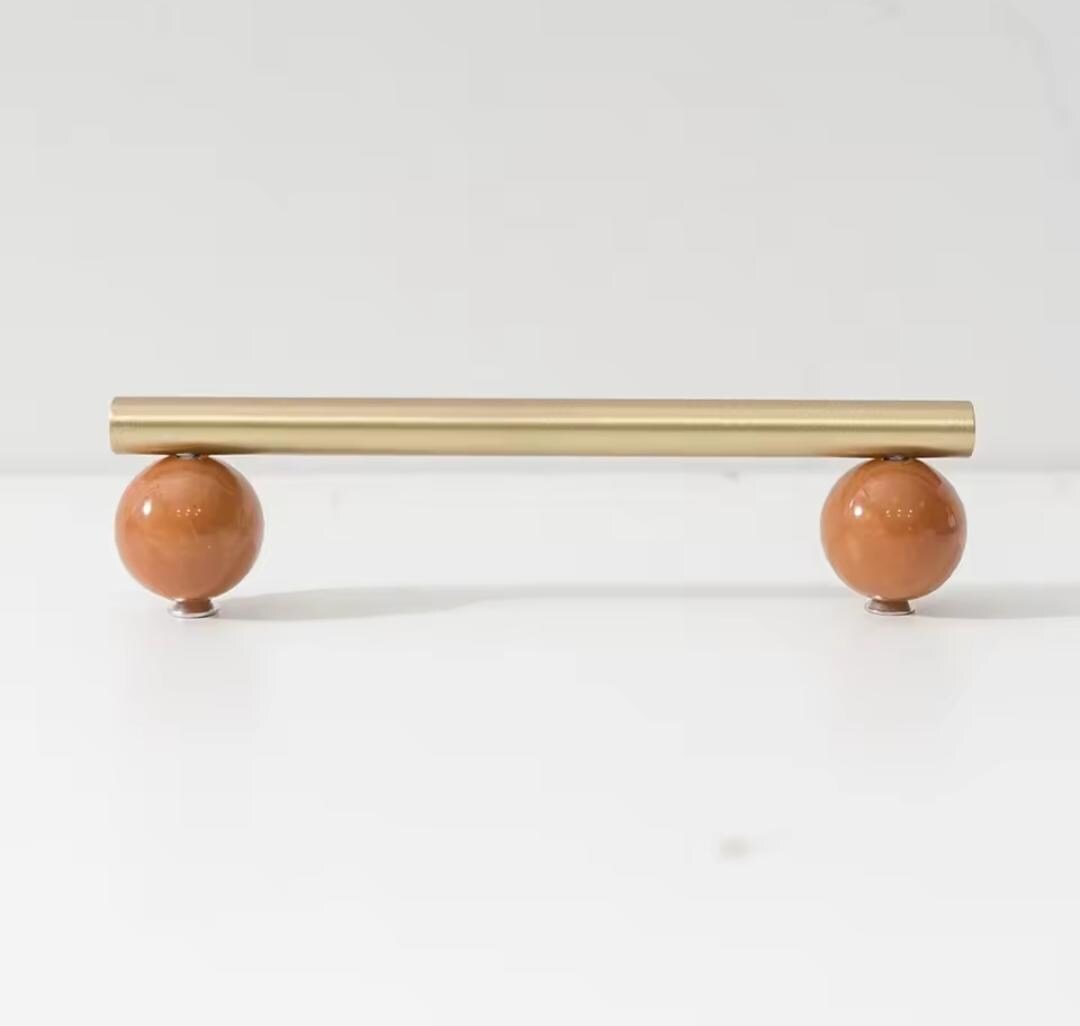 Silky matte gold brass bar handle resting on semi precious stone balls/colourful cabinet handle/stone furniture hardware/crystal drawer pull