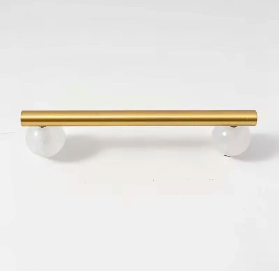 Silky matte gold brass bar handle resting on semi precious stone balls/colourful cabinet handle/stone furniture hardware/crystal drawer pull