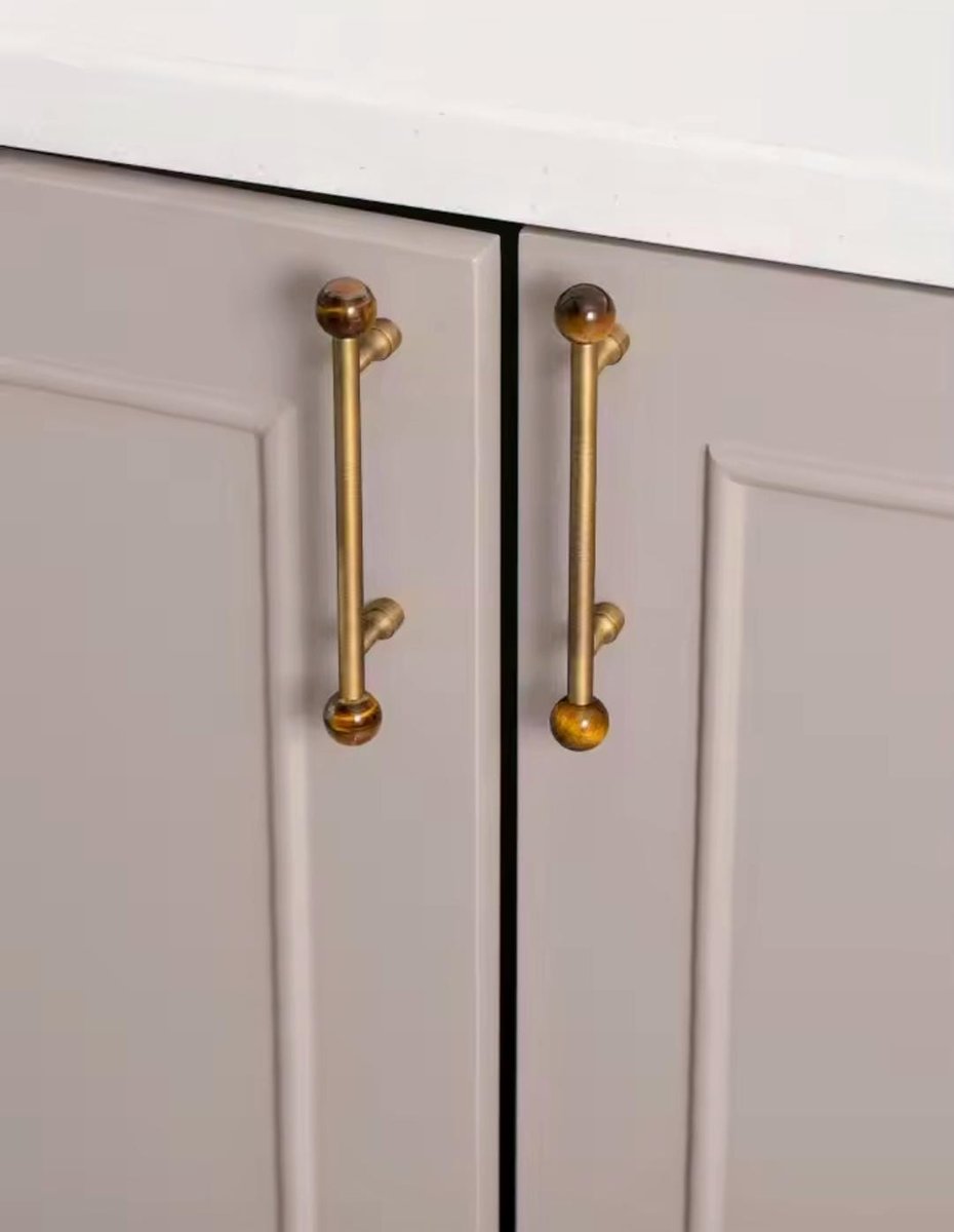 Bronze bar handle resting on tiger eye stone ball/Bronze and tiger eye cabinet handle/Semi precious stone and aged brass furniture hardware