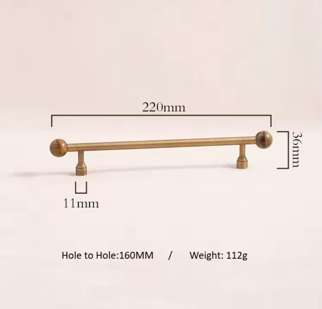 Bronze bar handle resting on tiger eye stone ball/Bronze and tiger eye cabinet handle/Semi precious stone and aged brass furniture hardware