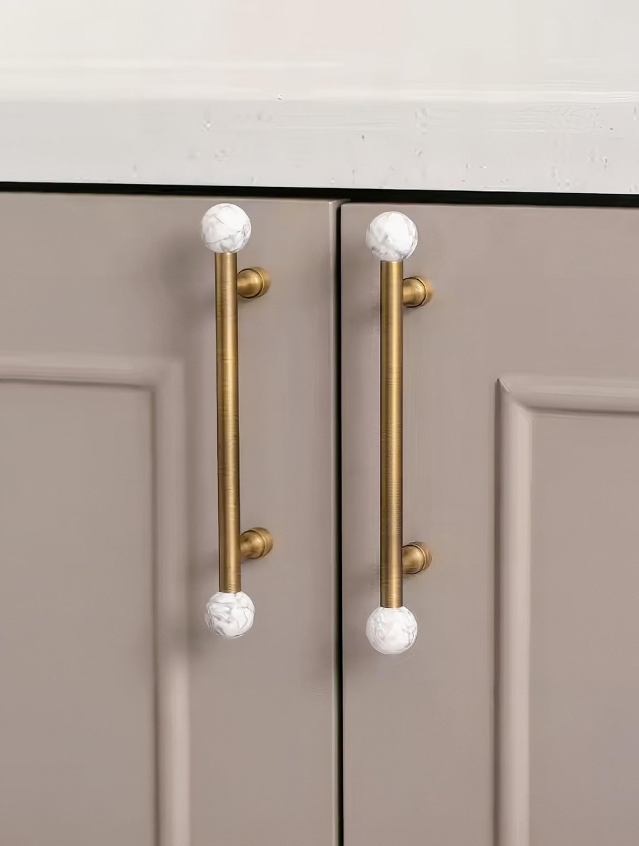 Bronze bar handle resting on white marbl ball/Bronze and marble stone cabinet handle/Semi precious stone and aged brass furniture hardware