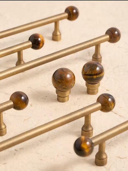 Bronze bar handle resting on tiger eye stone ball/Bronze and tiger eye cabinet handle/Semi precious stone and aged brass furniture hardware